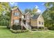 Beautiful two-story home with brick and vinyl siding and lush green landscaping at 3650 Pleasants Ridge Dr, Wake Forest, NC 27587