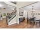 Inviting foyer with hardwood floors, a staircase, and a view of the dining area at 3650 Pleasants Ridge Dr, Wake Forest, NC 27587