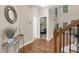 Hallway with hardwood floors that leads to a view of a bedroom and living area at 3650 Pleasants Ridge Dr, Wake Forest, NC 27587