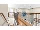 A hallway space is shown with a view of the downstairs living spaces at 3650 Pleasants Ridge Dr, Wake Forest, NC 27587