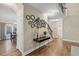 Hallway with hardwood floors, modern lighting, and an open view to dining room and staircase at 3650 Pleasants Ridge Dr, Wake Forest, NC 27587
