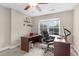 Functional home office boasts a spacious desk, comfortable chair, and natural light for a productive workspace at 3650 Pleasants Ridge Dr, Wake Forest, NC 27587