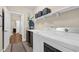 A functional laundry room is showcased with shelving, a folding table, and appliances at 3650 Pleasants Ridge Dr, Wake Forest, NC 27587