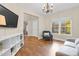 Comfortable living room with hardwood flooring, natural lighting, and modern decor at 3650 Pleasants Ridge Dr, Wake Forest, NC 27587