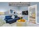 Comfortable living area with a sofa, table, television, and doorway to another room at 3650 Pleasants Ridge Dr, Wake Forest, NC 27587