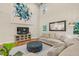 Spacious living room with hardwood floors, modern furnishings, and an open floor plan at 3650 Pleasants Ridge Dr, Wake Forest, NC 27587