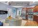 Open-concept living area with kitchen, plush seating, and a TV for a cozy, modern living experience at 3650 Pleasants Ridge Dr, Wake Forest, NC 27587