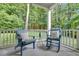 Inviting porch with comfortable blue Adirondack chairs, perfect for relaxation and enjoying the outdoors at 3650 Pleasants Ridge Dr, Wake Forest, NC 27587