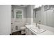 Clean bathroom with white tile, vanity, and natural light at 3812 Vesta Dr, Raleigh, NC 27603