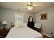 Comfortable bedroom with neutral tones, hardwood floors, and ample natural light at 3812 Vesta Dr, Raleigh, NC 27603