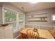 Bright dining room with window views, natural light, and light wood floors at 3812 Vesta Dr, Raleigh, NC 27603