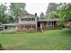 Inviting two-story home featuring a brick and siding facade, complemented by a lush green lawn at 3812 Vesta Dr, Raleigh, NC 27603