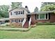 Charming brick and siding two-story home with inviting front steps and a well-maintained yard at 3812 Vesta Dr, Raleigh, NC 27603