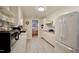 Bright kitchen featuring white cabinets, stainless appliances, and open layout at 3812 Vesta Dr, Raleigh, NC 27603