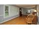 Bright living room featuring hardwood floors, large windows, and classic rocking chairs for a cozy atmosphere at 3812 Vesta Dr, Raleigh, NC 27603