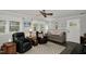 Cozy living room featuring comfortable seating, natural light, and a ceiling fan for comfort at 3812 Vesta Dr, Raleigh, NC 27603