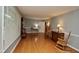 Open living room featuring natural light, hardwood floors, and versatile space for furniture arrangement at 3812 Vesta Dr, Raleigh, NC 27603