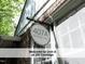 Charming address sign displaying '407A Coolidge Street' next to a window and brick wall at 407 Coolidge St # A, Chapel Hill, NC 27516