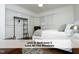 A serene bedroom is enhanced by a ceiling fan and multiple windows at 407 Coolidge St # A, Chapel Hill, NC 27516