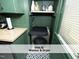 Convenient laundry area with a stacked washer and dryer unit, next to the kitchen counter at 407 Coolidge St # A, Chapel Hill, NC 27516