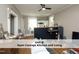 Inviting living room featuring open layout, ceiling fan, and kitchen with ample counter space at 407 Coolidge St # A, Chapel Hill, NC 27516