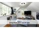 Bright living room featuring ample natural light from large windows, perfect for relaxation and entertaining at 407 Coolidge St # A, Chapel Hill, NC 27516