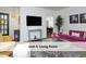Cozy living room with stylish furniture, a glass coffee table, and artwork displayed on the walls at 407 Coolidge St # A, Chapel Hill, NC 27516