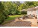 Well-maintained backyard featuring a patio, fire pit, and plenty of green space for outdoor activities at 413 Braxman Ln, Holly Springs, NC 27540