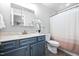 Cozy bathroom features neutral walls, updated vanity, and shower-tub combination at 413 Braxman Ln, Holly Springs, NC 27540
