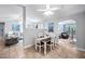 Dining room with seating for four, open to kitchen and living room at 413 Braxman Ln, Holly Springs, NC 27540