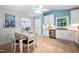 Open-concept kitchen with stainless appliances adjacent to dining area at 413 Braxman Ln, Holly Springs, NC 27540