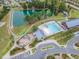 Aerial shot showcasing the community pool, lake, playground, clubhouse, and surrounding neighborhood at 428 Mill Station Ln, Wendell, NC 27591