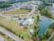 An aerial view shows a community pool, clubhouse, lake, and surrounding neighborhood at 428 Mill Station Ln, Wendell, NC 27591