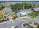 Aerial view capturing the community's pool, pond, clubhouse, playground, and surrounding homes at 428 Mill Station Ln, Wendell, NC 27591