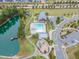 An aerial view shows the community pool, lake, playground, and clubhouse at 428 Mill Station Ln, Wendell, NC 27591