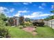 Landscaped backyard with storage shed and brick patio at 428 Mill Station Ln, Wendell, NC 27591