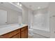 Bright bathroom featuring a vanity with a large mirror and a shower-tub combination at 428 Mill Station Ln, Wendell, NC 27591