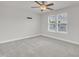 Bright bedroom featuring a ceiling fan, neutral walls, and large windows, creating a relaxing atmosphere at 428 Mill Station Ln, Wendell, NC 27591