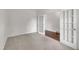 Bedroom featuring carpet and french doors leading to hardwood floors at 428 Mill Station Ln, Wendell, NC 27591