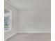 Carpeted bedroom featuring a large window with horizontal blinds at 428 Mill Station Ln, Wendell, NC 27591