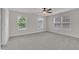 Bedroom with neutral walls and large windows providing natural light for a calming and peaceful space at 428 Mill Station Ln, Wendell, NC 27591