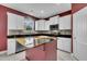 Beautiful kitchen with white cabinets, black granite countertops, stainless appliances, and center island at 428 Mill Station Ln, Wendell, NC 27591