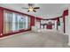 Open-concept living space featuring a kitchen with stainless appliances and a ceiling fan at 428 Mill Station Ln, Wendell, NC 27591