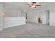 Open loft area with a ceiling fan, and view of a bathroom, perfect for a secondary living space at 428 Mill Station Ln, Wendell, NC 27591