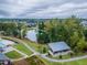 Scenic aerial view showcasing a pond with walking trails, lush landscaping, and a covered picnic area within a vibrant community at 428 Mill Station Ln, Wendell, NC 27591