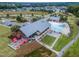 Expansive aerial view highlighting a community clubhouse, pool, outdoor seating, and manicured landscaping for residents to enjoy at 428 Mill Station Ln, Wendell, NC 27591