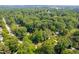 Overhead shot showcasing the property surrounded by lush greenery and a serene neighborhood at 4349 Pickwick Dr, Raleigh, NC 27613