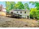Home's backyard features a spacious deck, stairs to the yard, and a basement entrance at 4349 Pickwick Dr, Raleigh, NC 27613