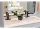 Elegant bathroom with marble countertops, dual sinks, and black faucets for a modern touch at 4349 Pickwick Dr, Raleigh, NC 27613