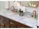 Bathroom with double vanity, marble countertop, and modern fixtures at 4349 Pickwick Dr, Raleigh, NC 27613
